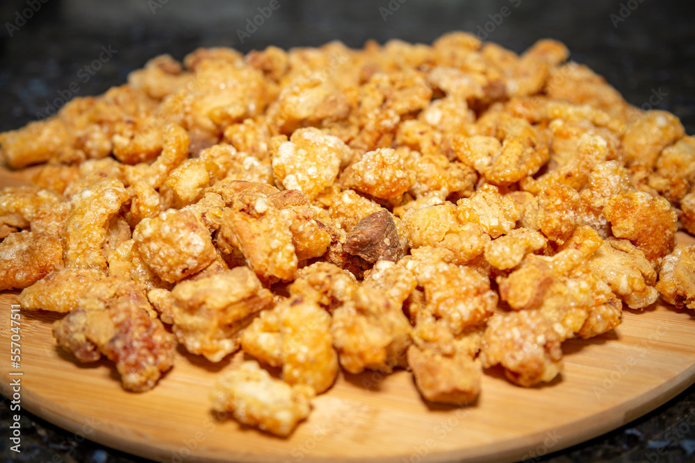 Crispy and fresh pork rinds in selective focus Crispy and fresh pork rinds in selective focus