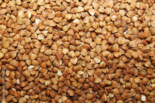 Background from dry buckwheat. Food concept. Background for design and graphic resources.