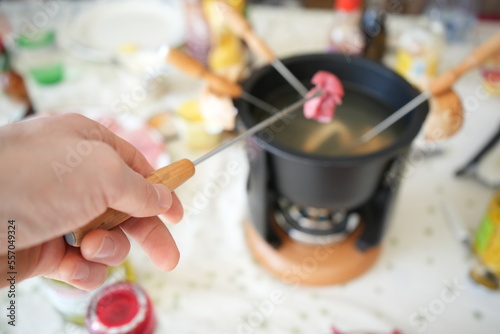 Eating fondue chinoise, Swiss meat hotpot 