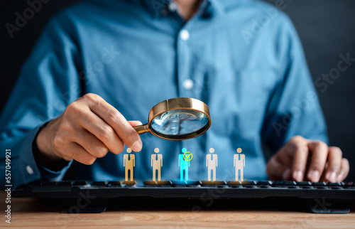 HRM or Human Resource Management, Businessman holding magnifier select and accept to manager icon which is among staff icons for human development recruitment leadership and customer target group.