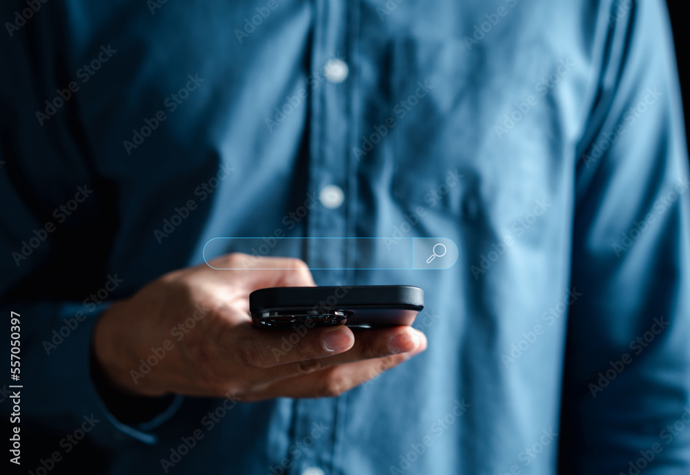Businessman using smartphone searching data for search engine Optimization or SEO, Internet connection online for find information, Using Search Console with website. Businessman using smartphone searching data for search engine Optimization or SEO, Internet connection online for find information, Using Search Console with website.