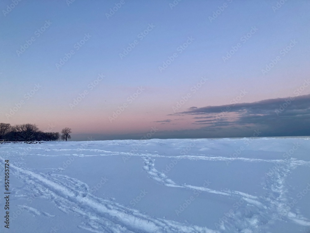 Pink sunset winter wonderland frozen Lake Michigan, North Shore, IL