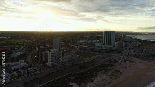 Aerial back traveling over South Elizabeth buildings along the ocean 