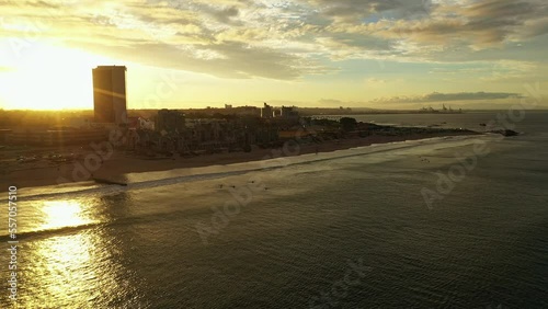 sunset in the city of Port Elizabeth surfers waiting waves  photo