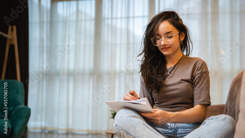 One woman young caucasian female student study and read at home