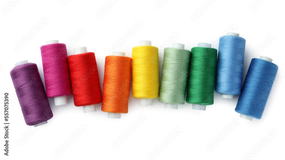 Set of different colorful sewing threads on white background, top view Set of different colorful sewing threads on white background, top view