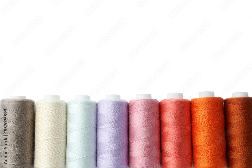 Set of different colorful sewing threads on white background, top view Set of different colorful sewing threads on white background, top view