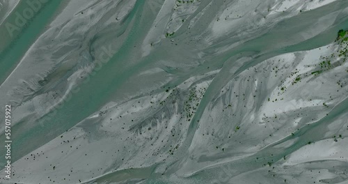 Rees river delta with slow flowing glacial water through floodplain, serpentine shape, top down photo