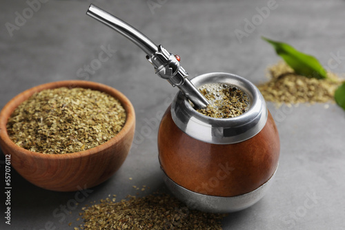 Foto Calabash with mate tea and bombilla on light grey table