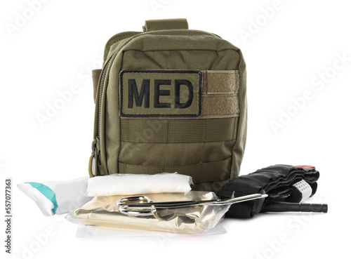 Military first aid kit with items isolated on white photo