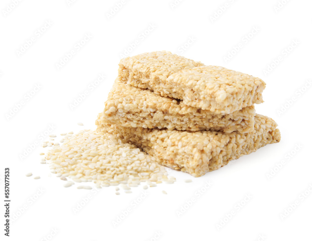 Delicious sweet kozinaki bars and sesame seeds on white background Delicious sweet kozinaki bars and sesame seeds on white background