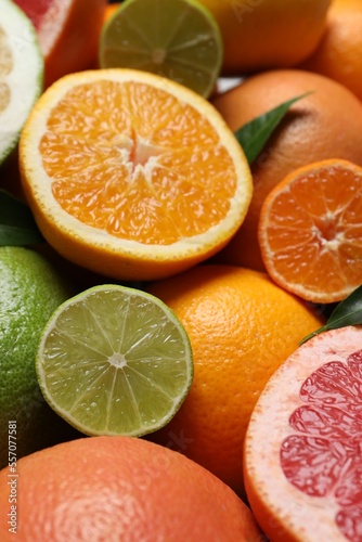 Fototapeta Naklejka Na Ścianę i Meble -  Different fresh whole and cut citrus fruits as background