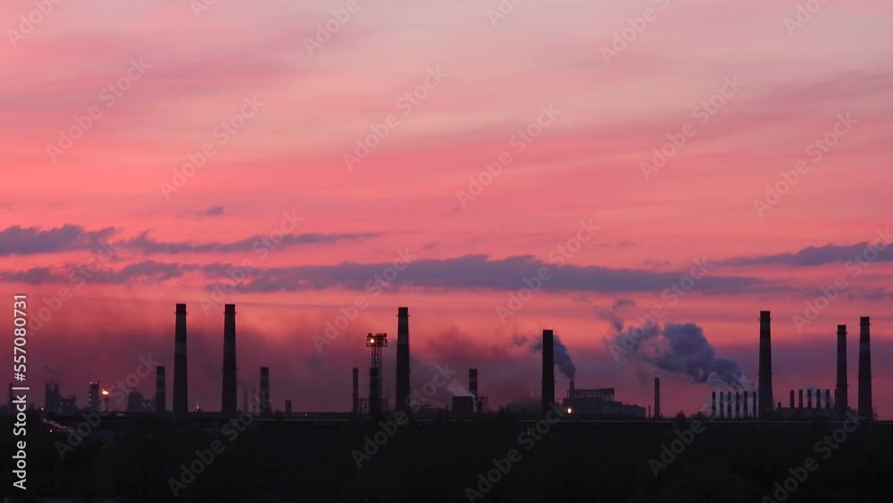 The cause of global warming. Chimneys background. The greenhouse effect. Poisoned air. Epic pollution of nature. Toxic substances. Metallurgical industrial factory. Smoking chimneys at dark dawn. The cause of global warming. Chimneys background. The greenhouse effect. Poisoned air. Epic pollution of nature. Toxic substances. Metallurgical industrial factory. Smoking chimneys at dark dawn.