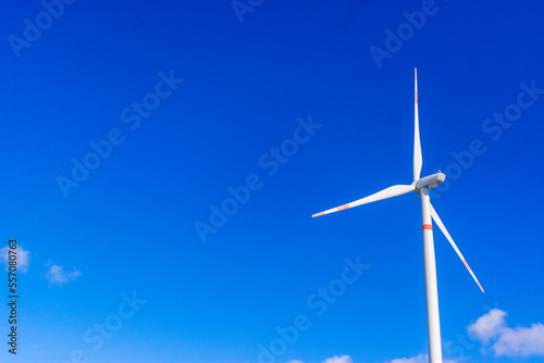 windmill in a sunshine day. Concept of alternative energy wind turbines horizontal at the south coast photo