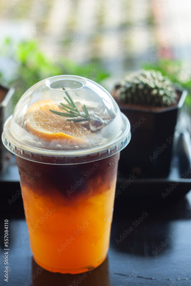 Glass of americano mixed with orange juice Glass of americano mixed with orange juice