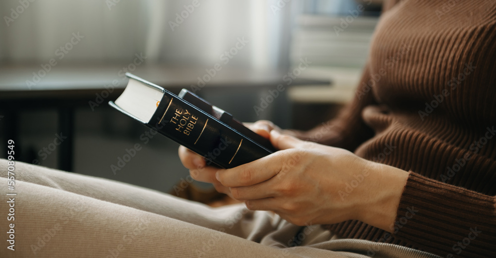 Hands together in prayer to God along with the bible In the Christian concept and religion, woman pray in the Bible Hands together in prayer to God along with the bible In the Christian concept and religion, woman pray in the Bible