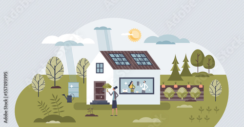 Green home with sustainable organic nature resource usage tiny person concept. Renewable electricity production with solar roof panels vector illustration. Bio style house with organic eco garden.