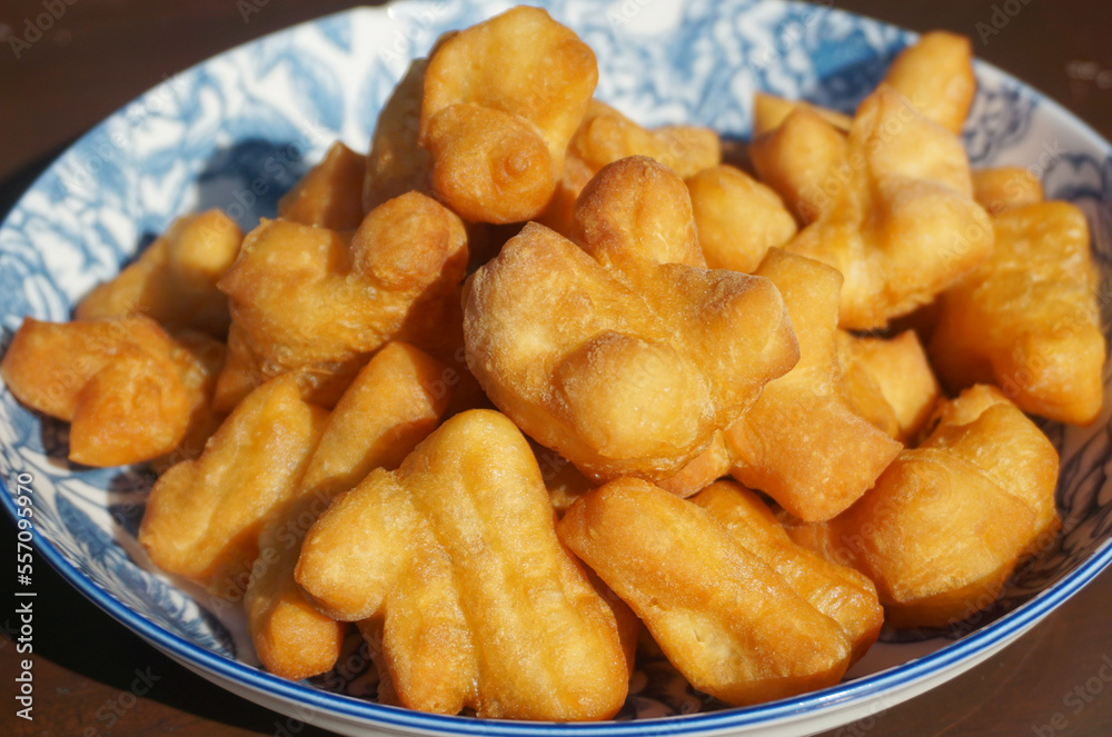 The breakfast made from fried flour is called Patongo on plate. Chinese Bread Stick, The breakfast made from fried flour is called Patongo on plate. Chinese Bread Stick,