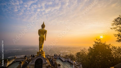 Time Lapse of The Golden buddha in sunrise. Aerial view sunrise at Wat Phra That Kao Noi in Nan Province , Thailand. Time Lapse Sunrise Buddha and Sea of Fog

