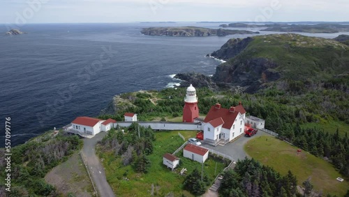 A panning reveal of the coastline by Long Point Lighthouse at Crow Head, near Twillingate, Newfoundland and Labrador