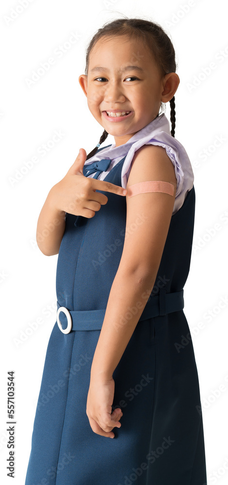 Asian student little girl showing pointing with finger to bandage on her arm shoulder with vaccinations, isolated background Asian student little girl showing pointing with finger to bandage on her arm shoulder with vaccinations, isolated background