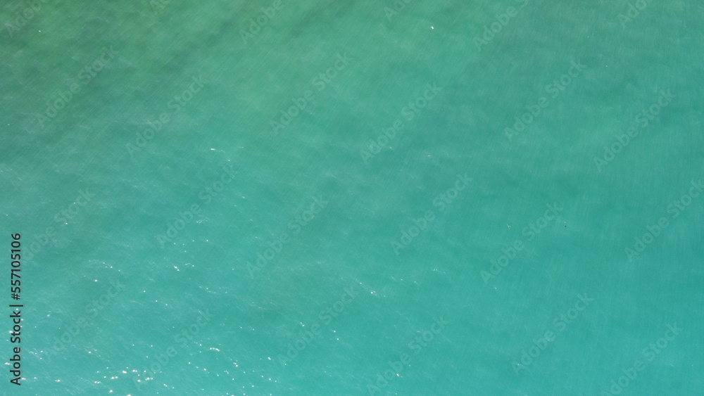 texture of clear emerald sea water, top view