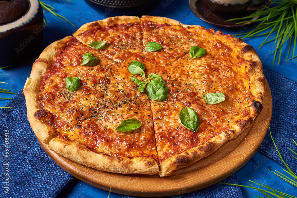 italian pizza with mint leaves on a blue background