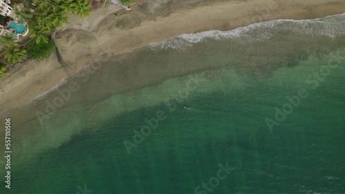 A couple enjoying snorkelling at Black Rock beach on the Caribbean island of Tobago drone view photo