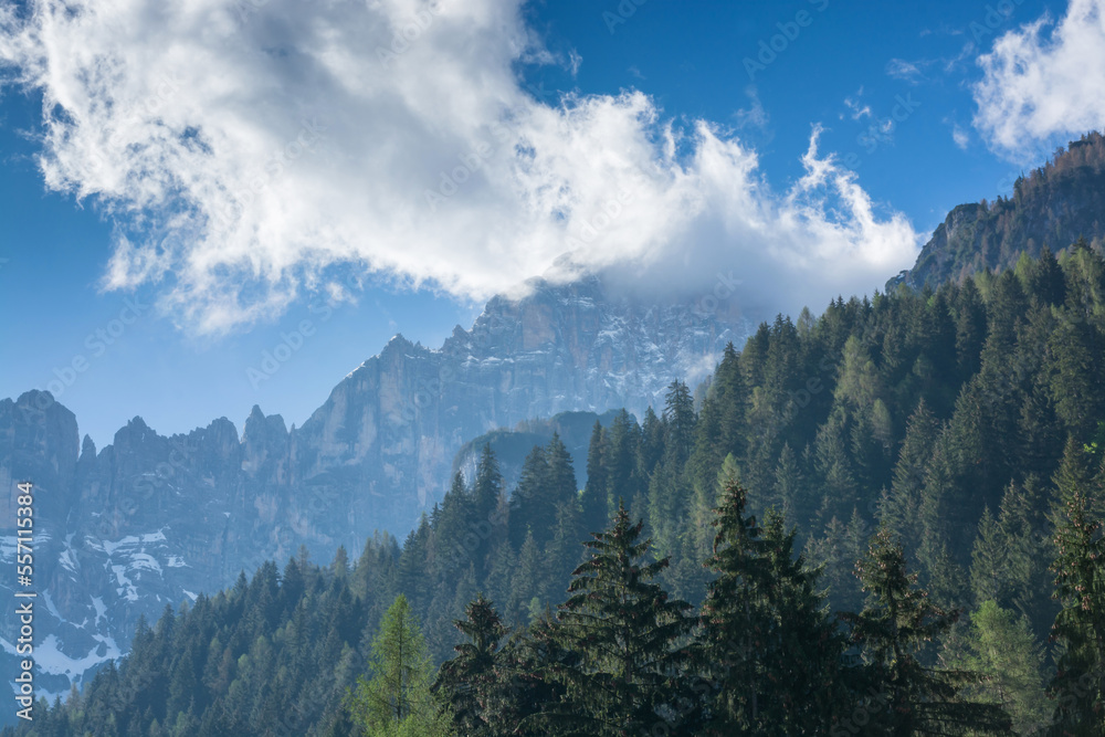 View in the Dolomites on mountains and a cloud on a blue sky