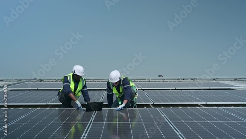 Wallpaper Mural Both of Engineer in charge of solar panel installation The installation of solar energy conversion into electricity for a warehouse is currently being investigated. Torontodigital.ca