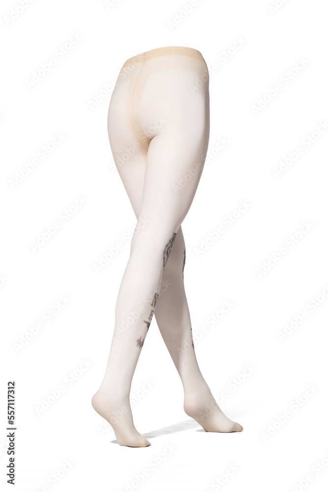 Detailed shot of beige tights with a color print imitating tattoo at the front. The tattoo-effect pantyhose have a shape of walking women's legs. The clothes are isolated on the white background. Detailed shot of beige tights with a color print imitating tattoo at the front. The tattoo-effect pantyhose have a shape of walking women's legs. The clothes are isolated on the white background.