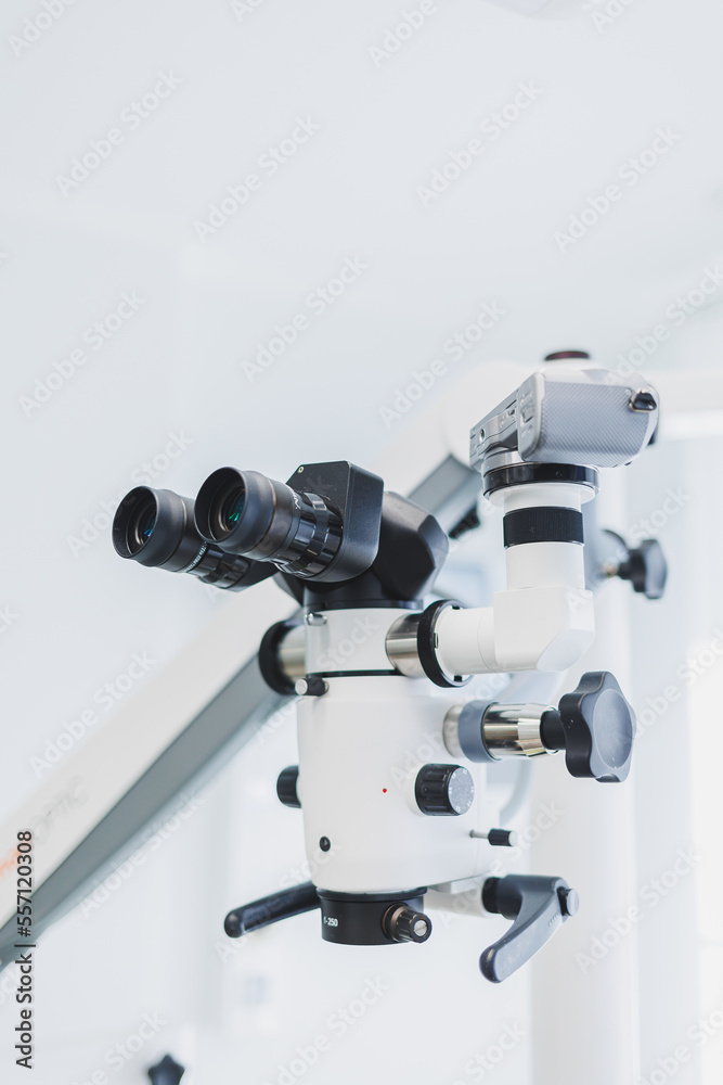 Dental microscope in a modern dental office. Modern dental treatment. Dental microscope in a modern dental office. Modern dental treatment.
