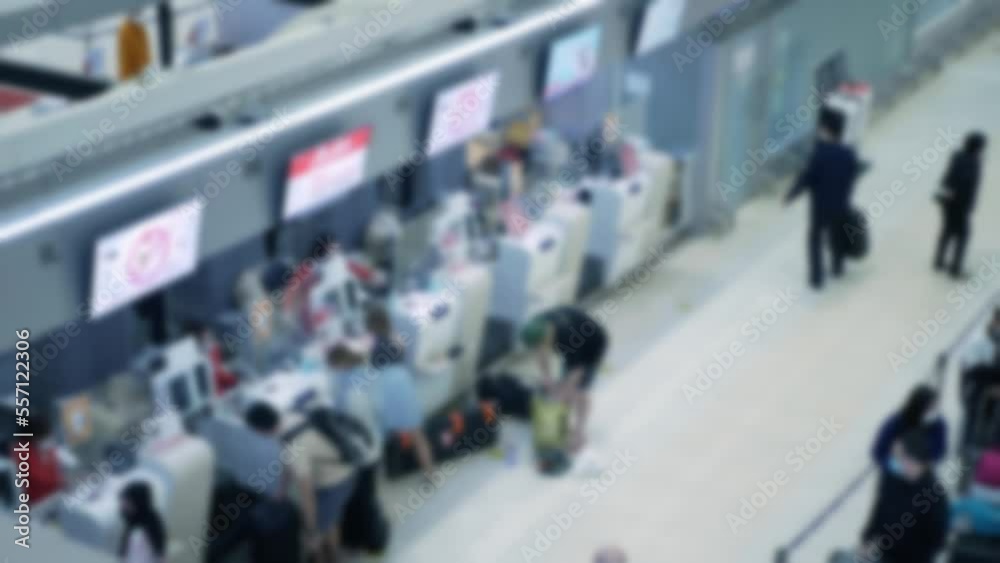 out of focusing blurred of crowded people passenger lines in airport waiting and check at check in counter area, open country, crowd in International Airport