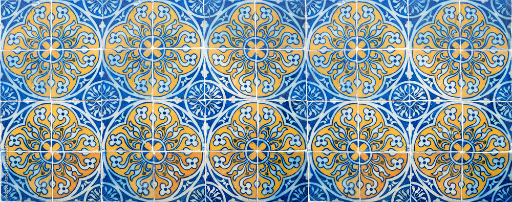 beautiful pattern of azulejos tiles at historic house facade lissabon, blue and yellow colored