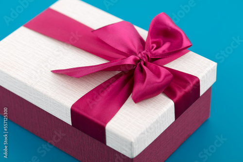 A beautifully wrapped gift on blue