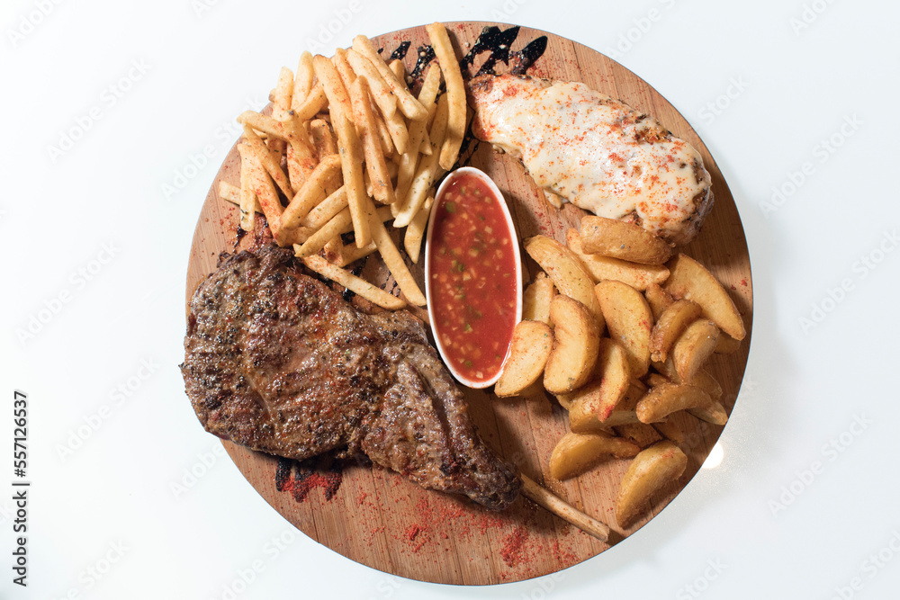 Obraz premium steak, fried french fries, fried meat in cheese, sauce, white background