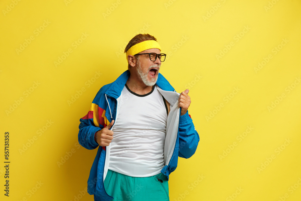 Screaming Man Celebrating. Handsome Grandfather Standing Over Isolated Yellow Background. Success. Concept 