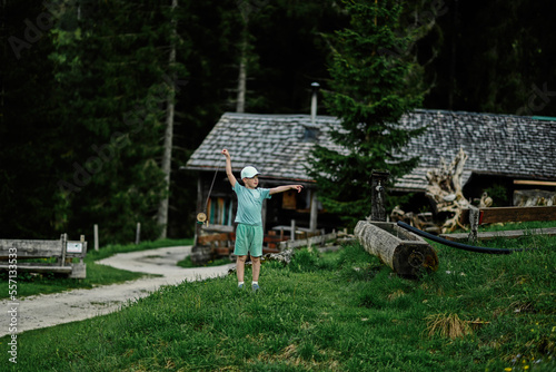 Boy stand against wooden house at Vorderer Gosausee, Gosau, Upper Austria. © AS Photo Family