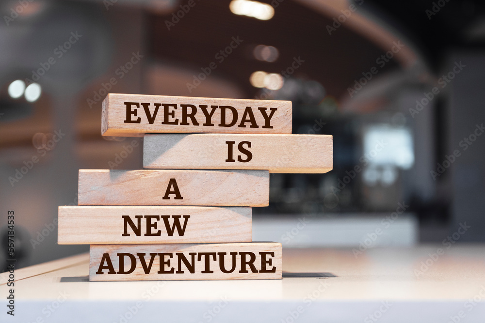 Wooden blocks with words 'Everyday is a new adventure'.