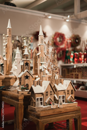 Wooden castle toy constructor at Christmas market vertical shot. Vintage festive wood home decor on holiday season.