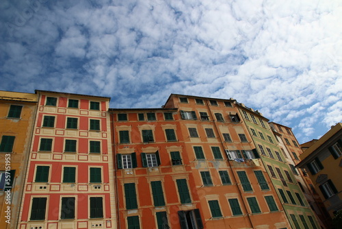 A low-angle shot of colorful waterfront buildings in Camogli on an October afternoon (Liguria, Italy)