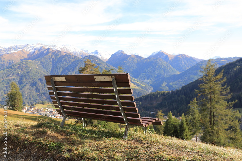 an empty bench in the mountain in tyrol	