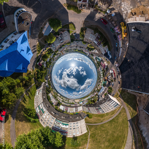 blue sphere inside overlooking old town  urban development  historic buildings and crossroads with cars. Transformation of spherical 360 panorama in abstract aerial view.