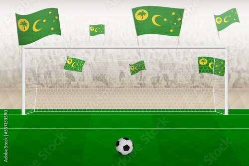 Cocos Islands football team fans with flags of Cocos Islands cheering on stadium, penalty kick concept in a soccer match.