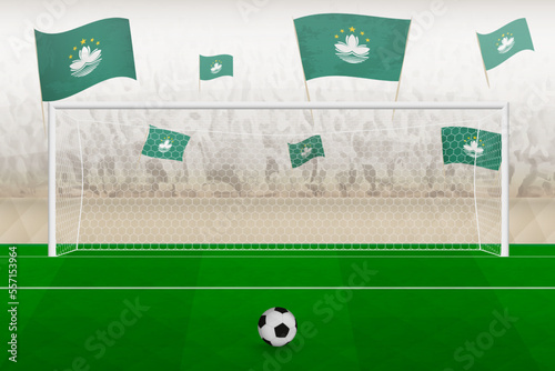 Macau football team fans with flags of Macau cheering on stadium, penalty kick concept in a soccer match.