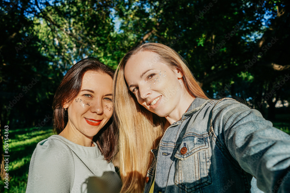 Fototapeta premium middle-aged womens with sequins freckles taking a selfie