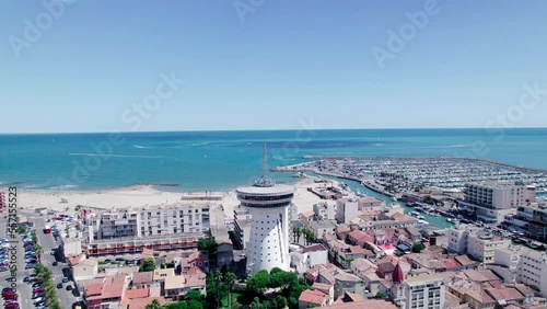 Aerial view of La Grande Motte with the control tower in the middle and the beach in the background 4K. photo