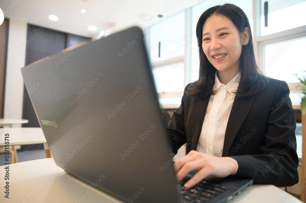 Portrait of successful asian young businesswoman working in her office Portrait of successful asian young businesswoman working in her office