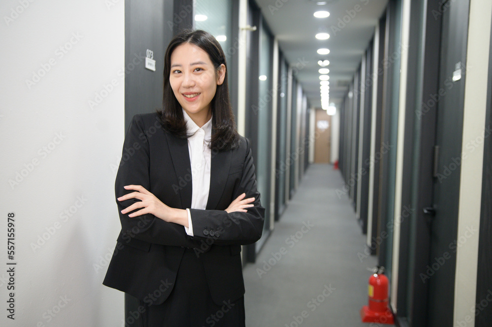 Portrait of successful asian young businesswoman working in her office Portrait of successful asian young businesswoman working in her office