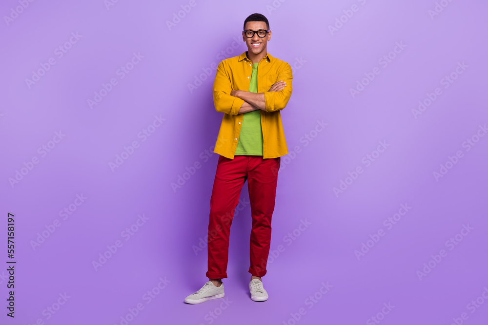 Full length photo of cheerful nice person toothy smile crossed hands isolated on violet color background